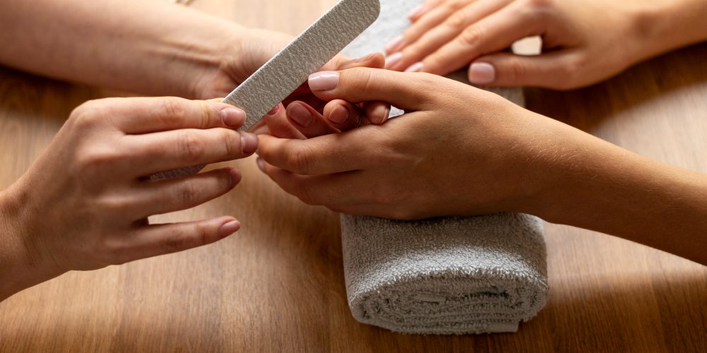 close-up-hand-holding-nail-file